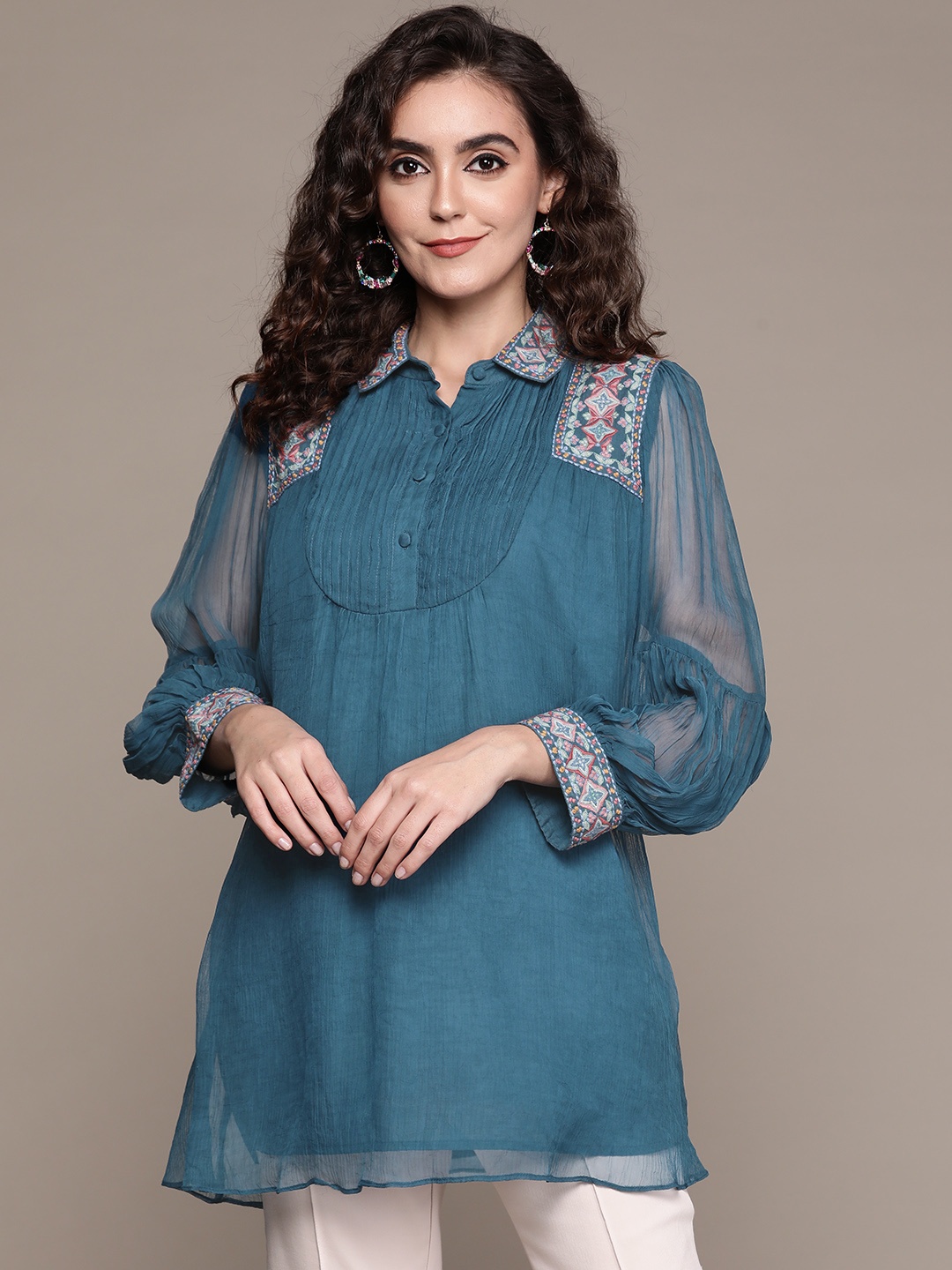 

Ritu Kumar Women Teal Blue Geometric Embroidered Shirt Collar Pleated Kurti