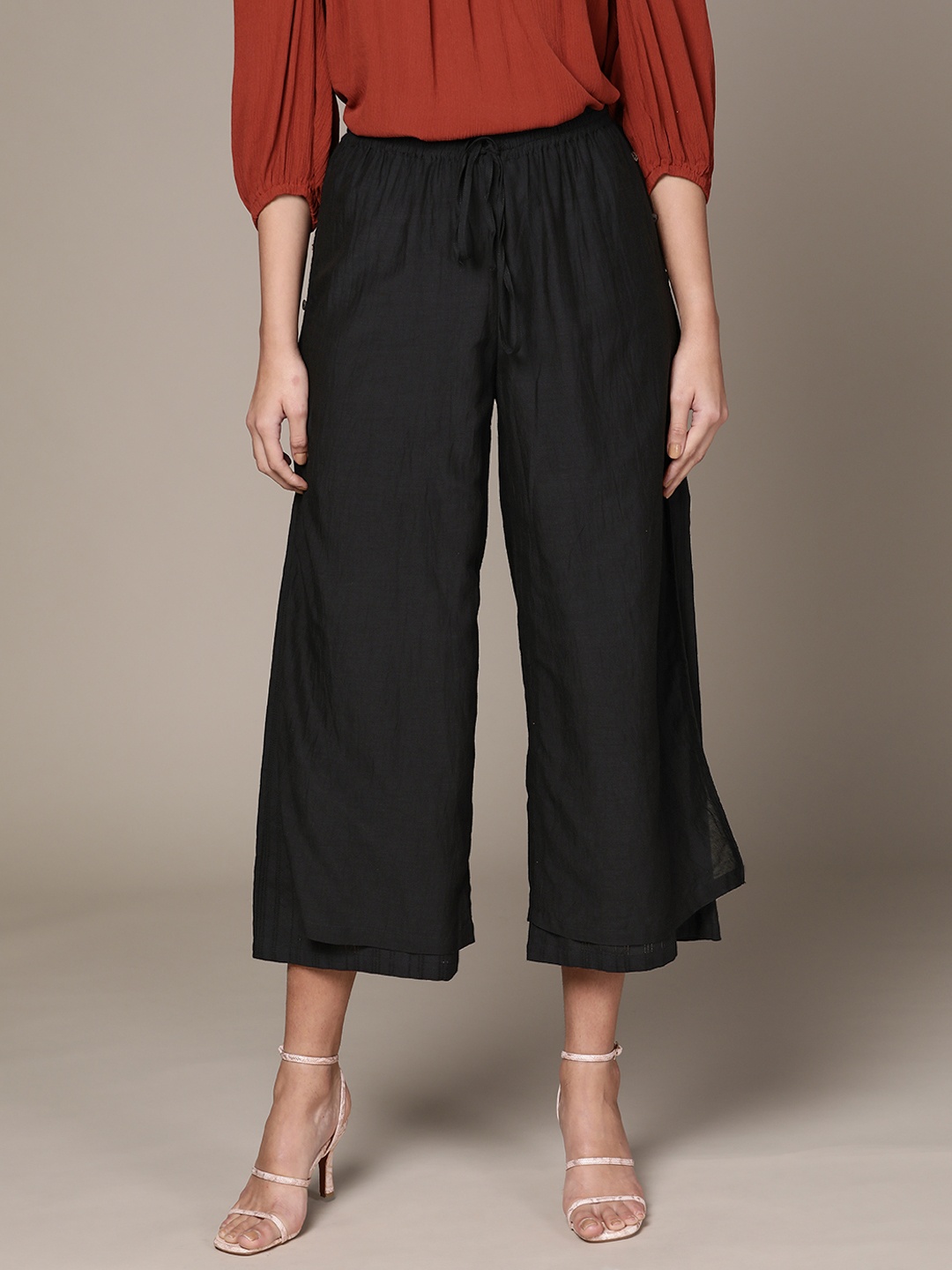 

Ritu Kumar Women Black Solid Straight Layered Palazzo