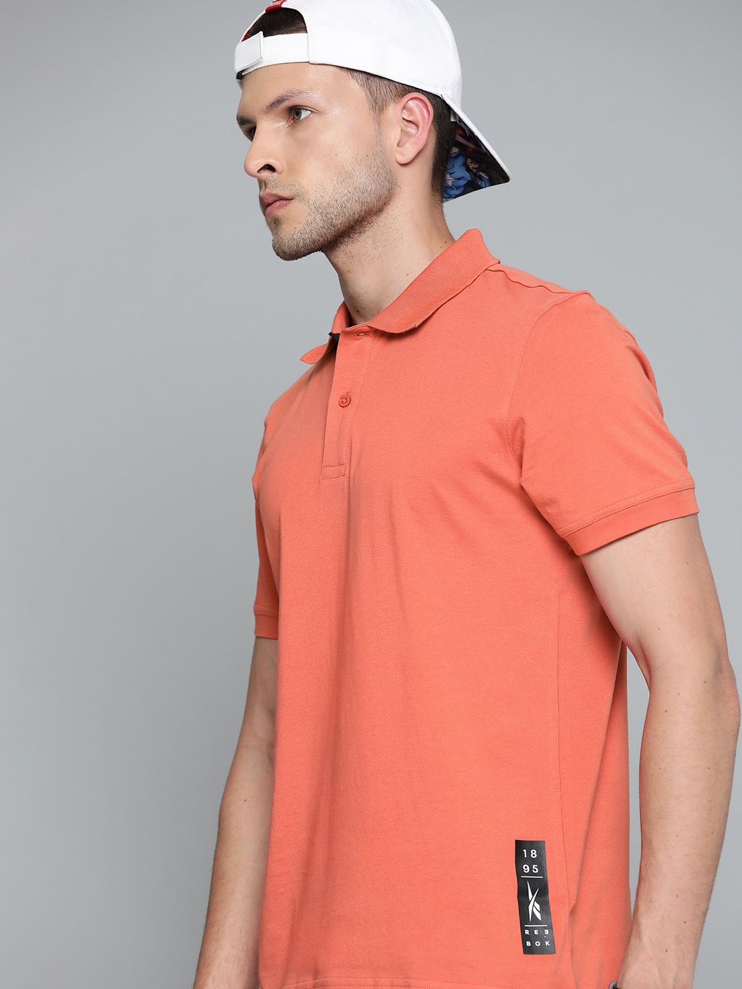 

Reebok Men Coral Solid Polo Collar Pure Cotton Training T-shirt