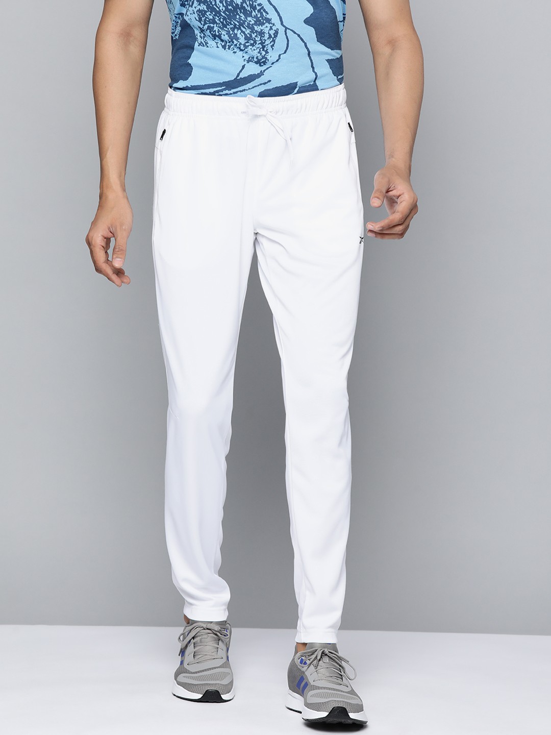 

Reebok Men White Solid Knitted Training WOR Elitage Track Pants