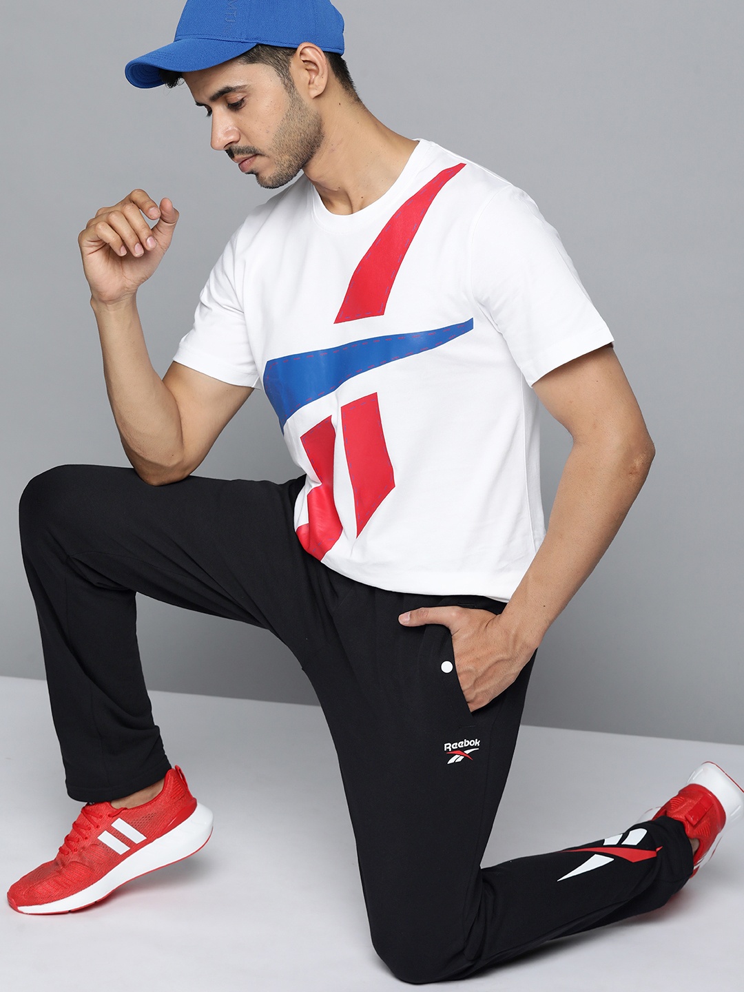

Reebok Classic Men Black Solid Brand Logo Printed Track Pants