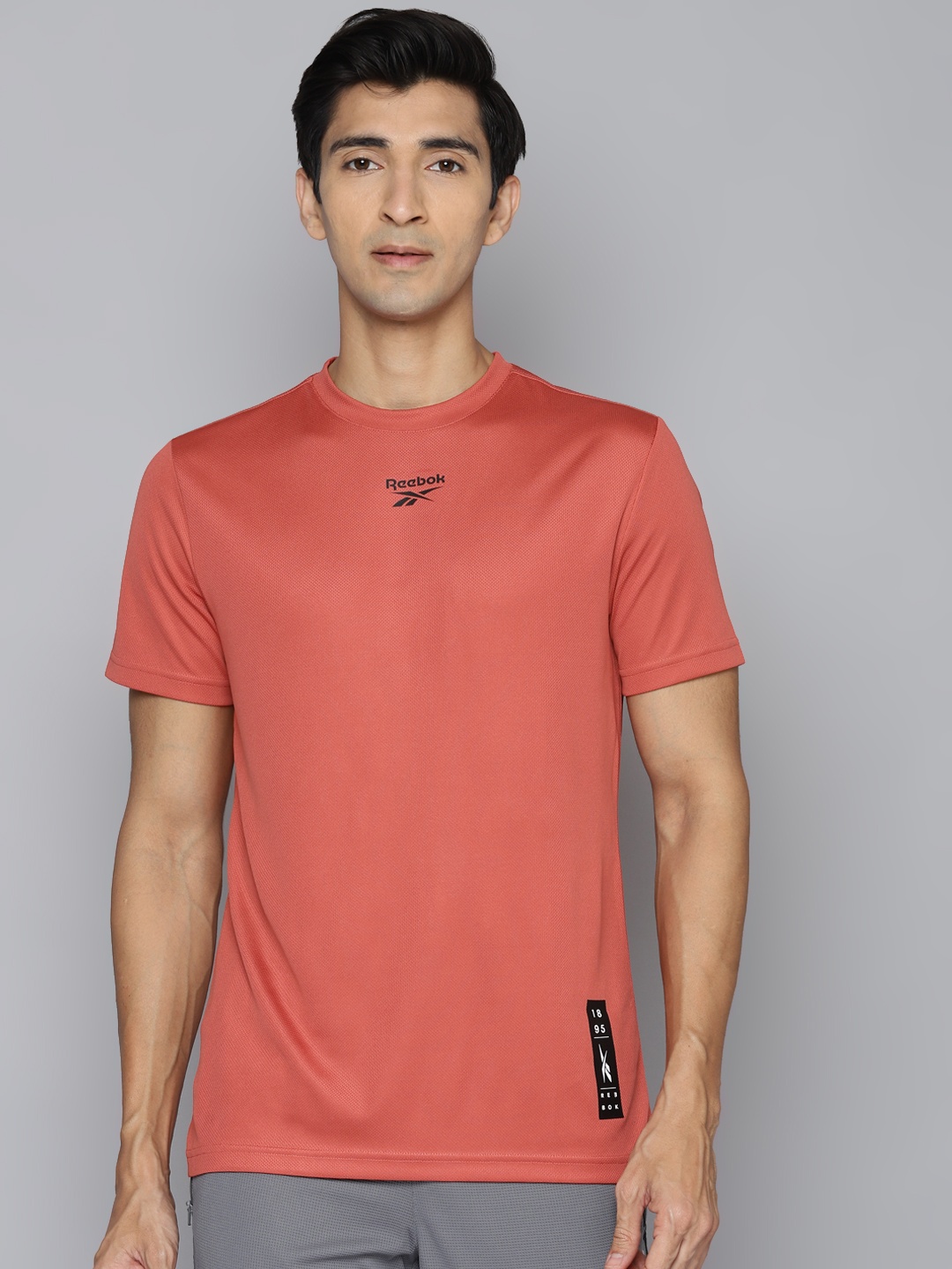 

Reebok Men Rust Red Graphic Printed Slim Fit Training Speedwick T-shirt