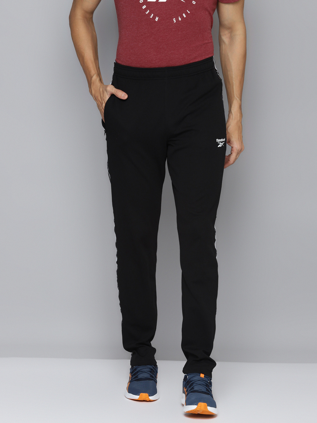 

Reebok Men Black Self Design WF Speedwick Track Pants with Taping Detail