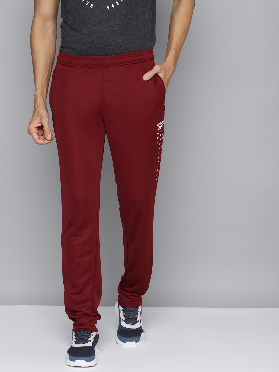 

Reebok Men Maroon ADV Solid Training Speedwick Track Pant