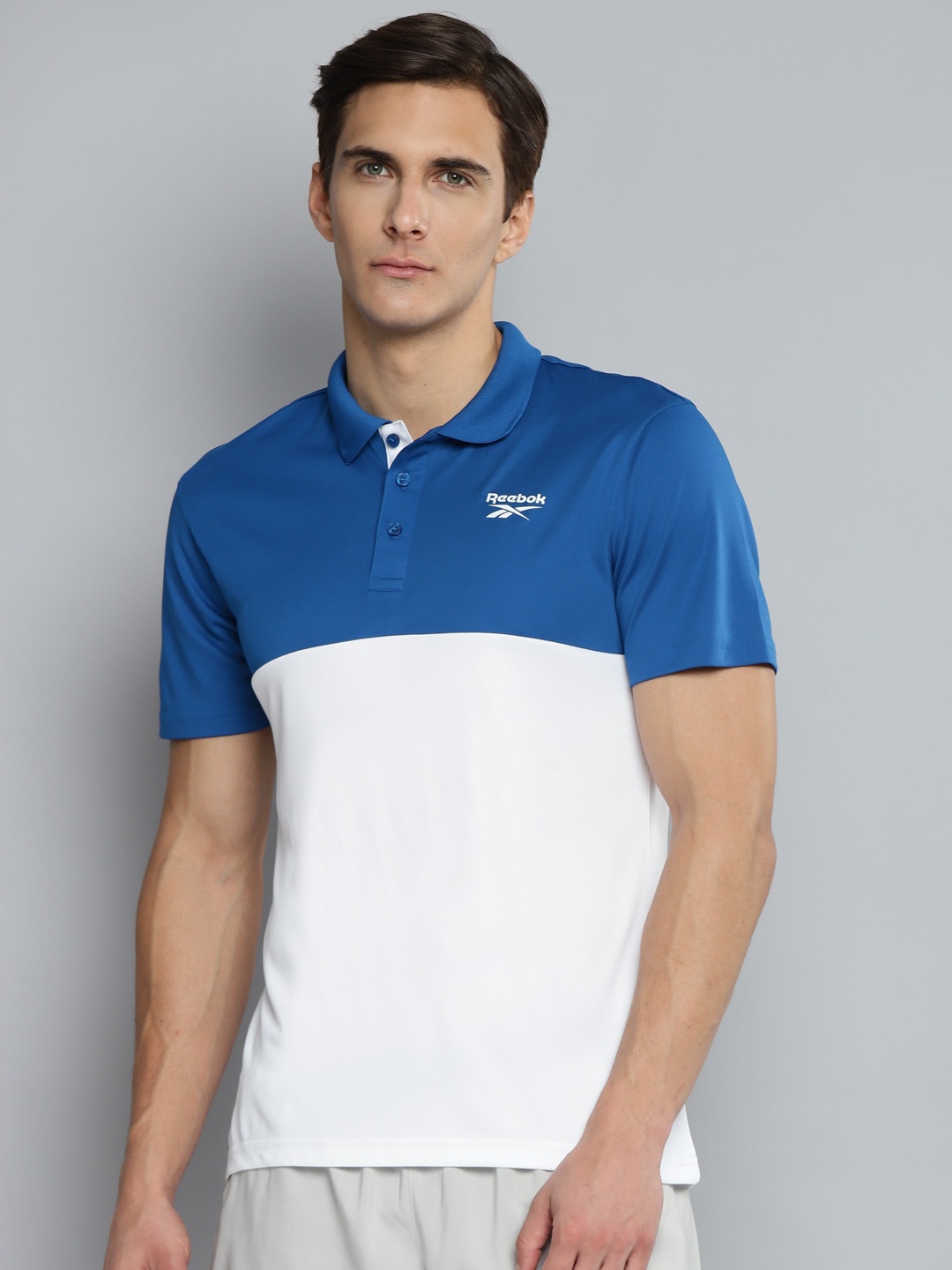 

Reebok Men Blue & White Colourblocked Speedwick Training Prime Polo T-shirt