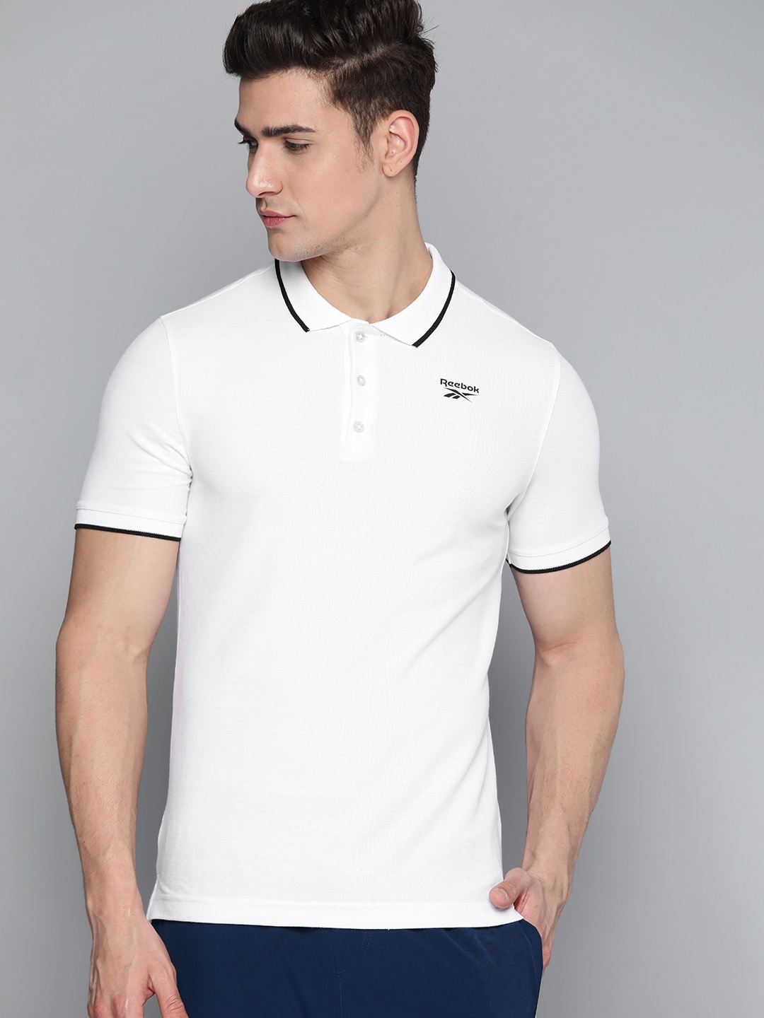 

Reebok Men White Solid Polo Training T-Shirt