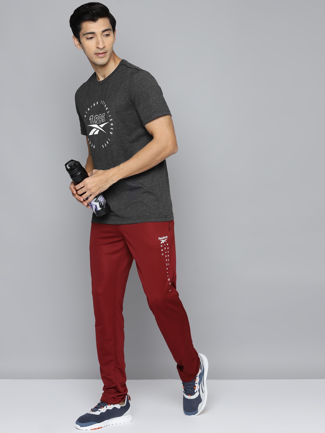 

Reebok Men Black Brand Logo Printed Slim Fit Workout T-shirt