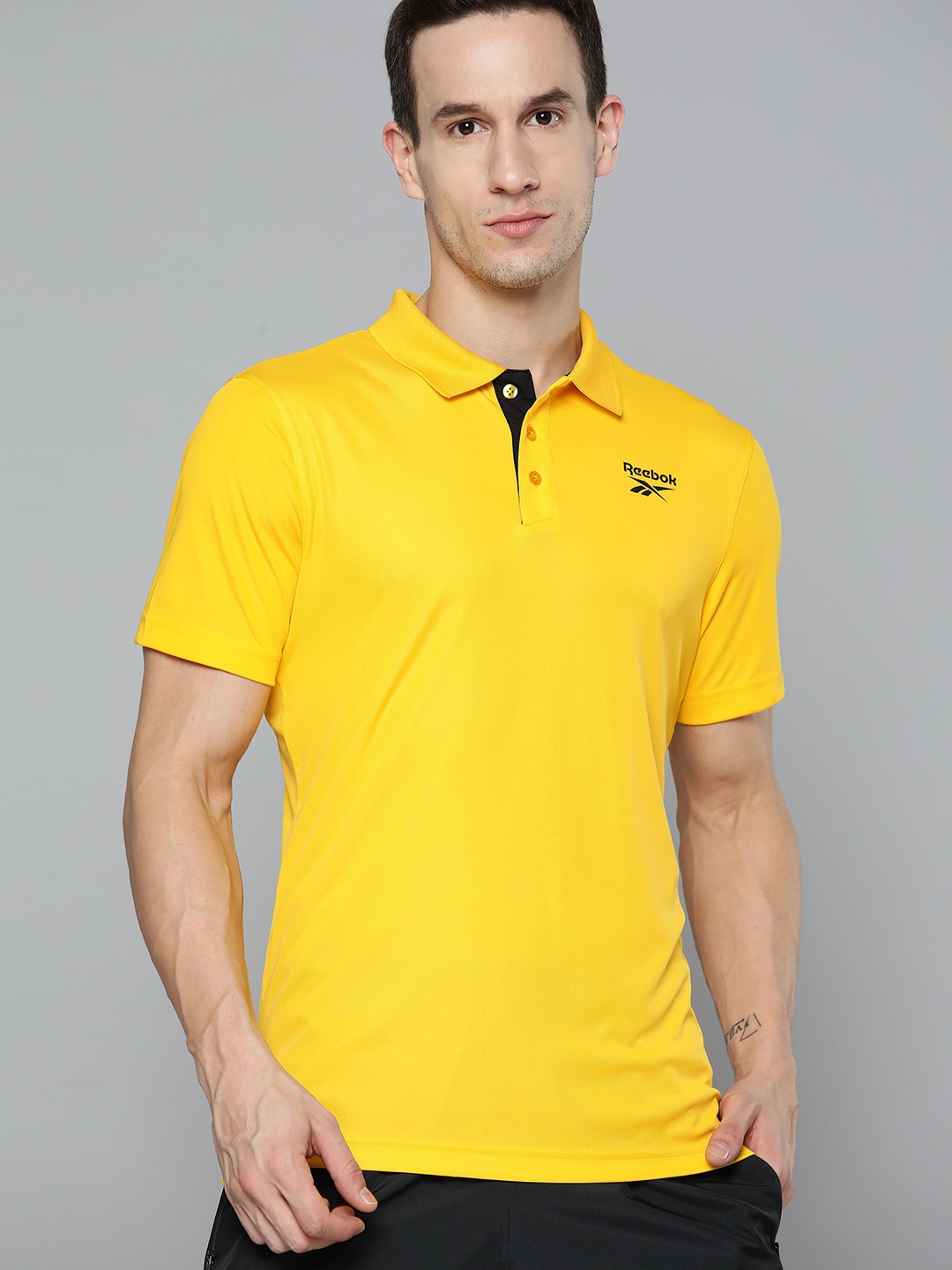 

Reebok Men Yellow Solid Speedwick Training Polo Collar T-shirt