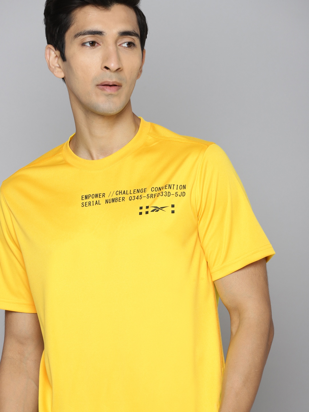 

Reebok Men Yellow & Black Typography Training Speedwick Performance T-shirt