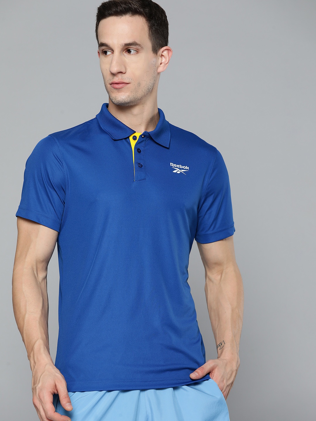 

Reebok Men Blue Solid Speedwick Training Polo Collar T-shirt