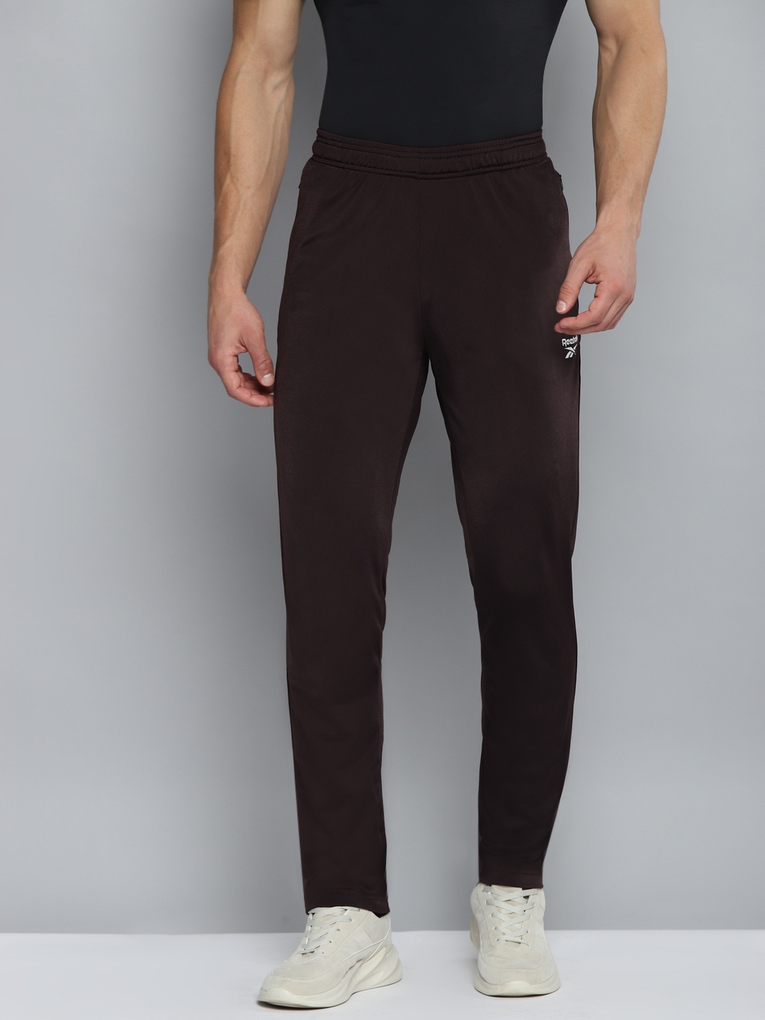 

Reebok Men Brown Solid Knitted Training Track Pants