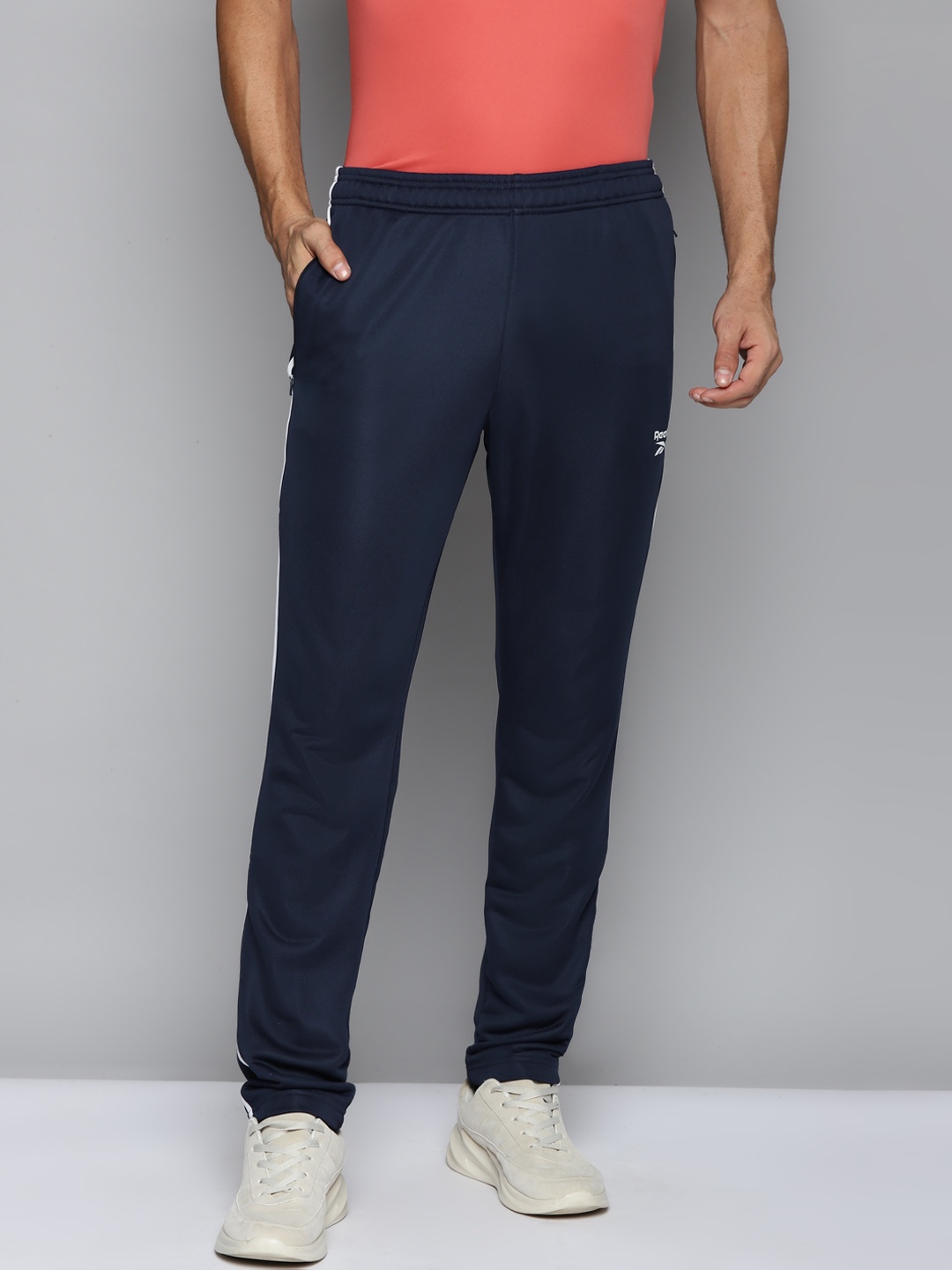 

Reebok Men Navy Blue Vector Solid Training Track Pants