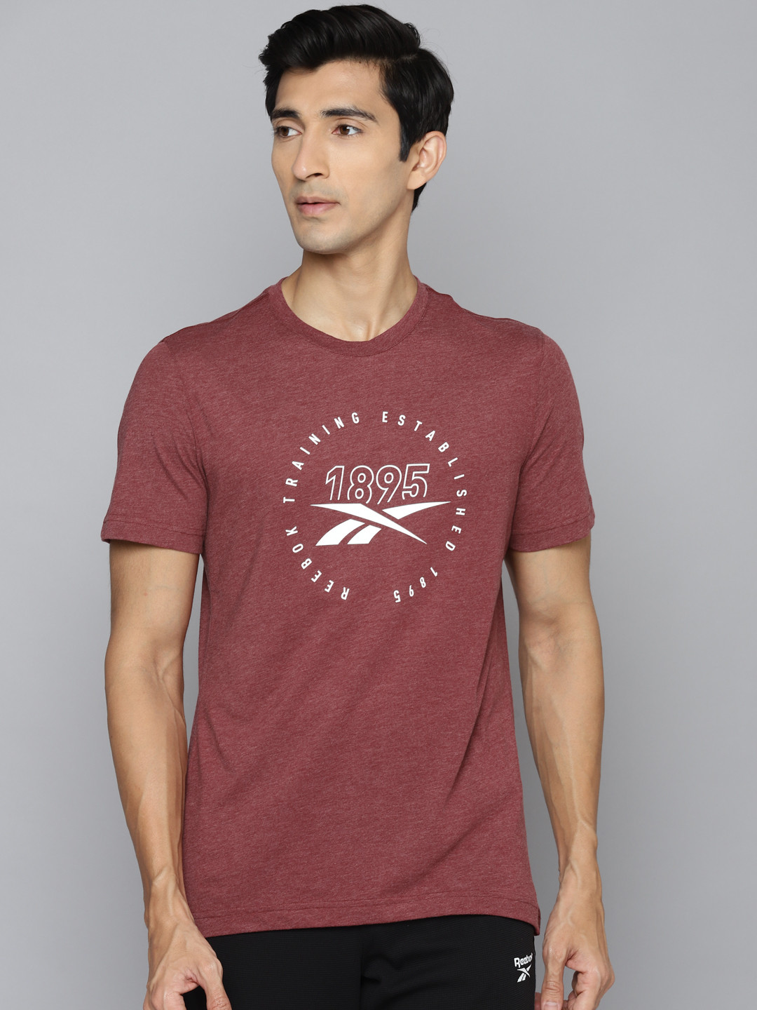 

Reebok Men Burgundy Brand Logo Printed Slim Fit Workout T-shirt