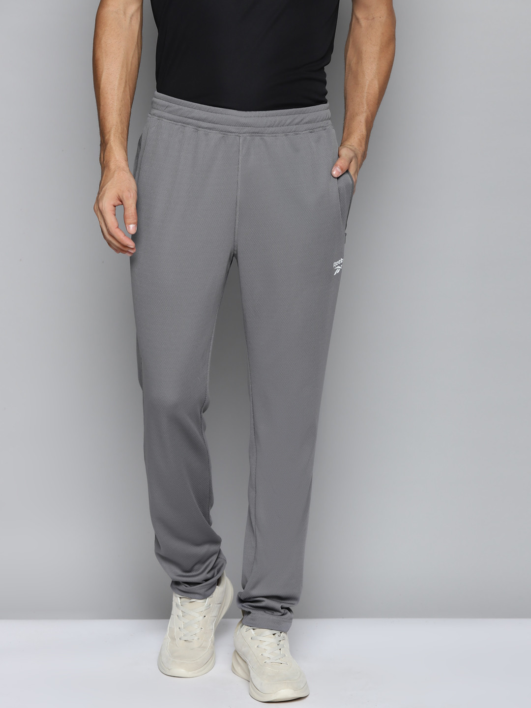 

Reebok Men Grey Prime Solid Training Track Pants