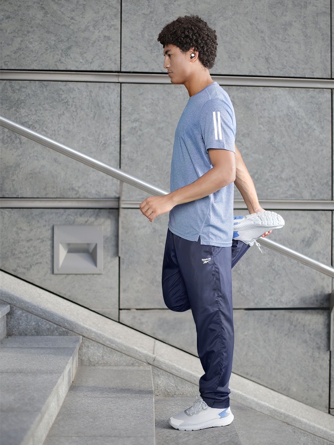 

Reebok Men Navy Blue Solid TE WVN OH Training Track Pants
