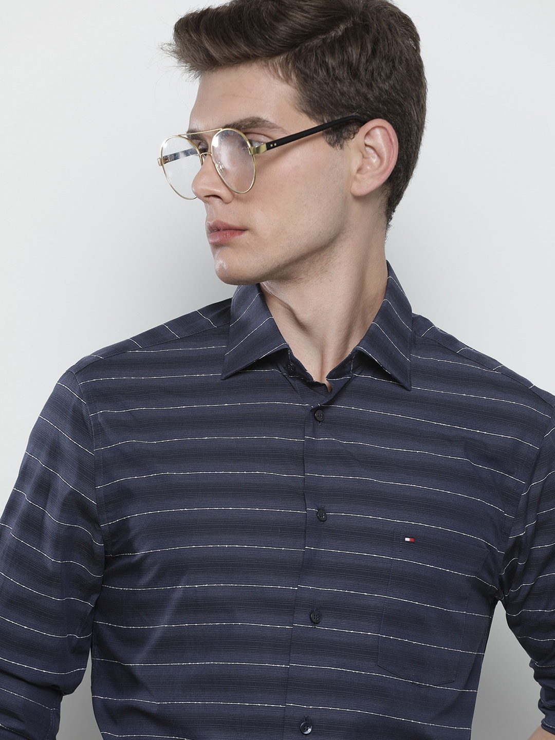 

Tommy Hilfiger Men Navy Blue Horizontal Stripes Full Sleeves Casual Shirt