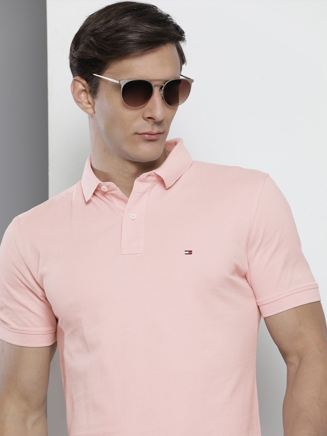 

Tommy Hilfiger Men Pink Solid Polo Collar Casual T-shirt