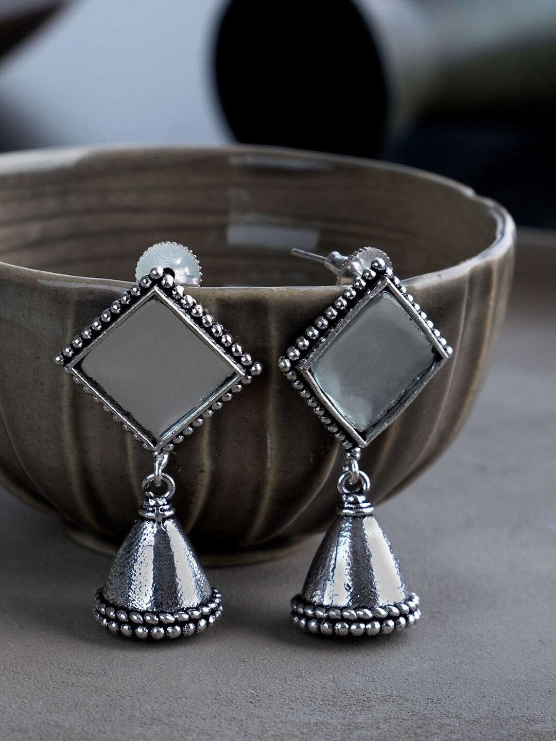 

Infuzze Women Silver-Toned Oxidized Diamond Shaped Jhumkas Earrings