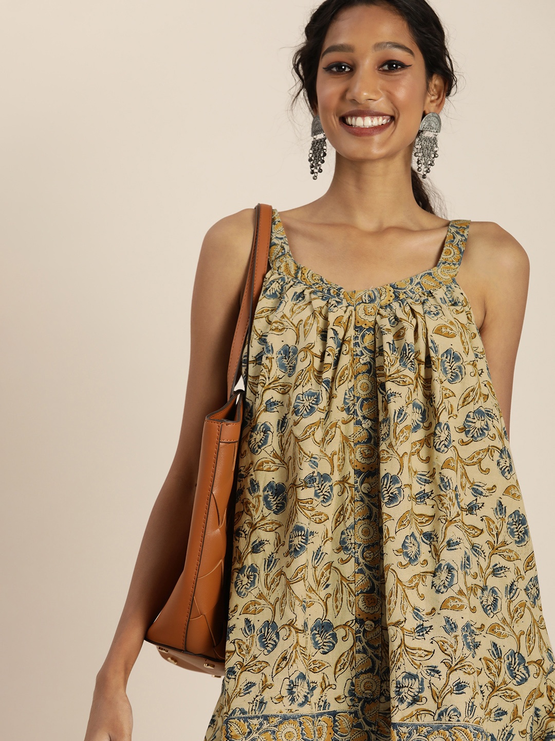 

Taavi Women Beige & Blue Kalamkari Printed Pure Cotton A-Line Sleeveless Top