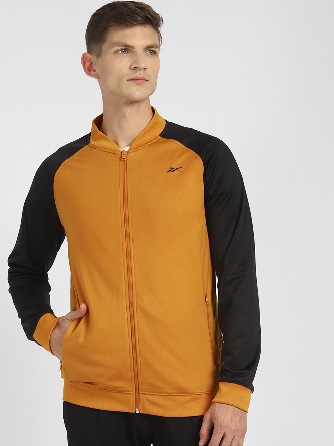

Reebok Men Beige Solid Hustle Tracktop Sporty Jacket