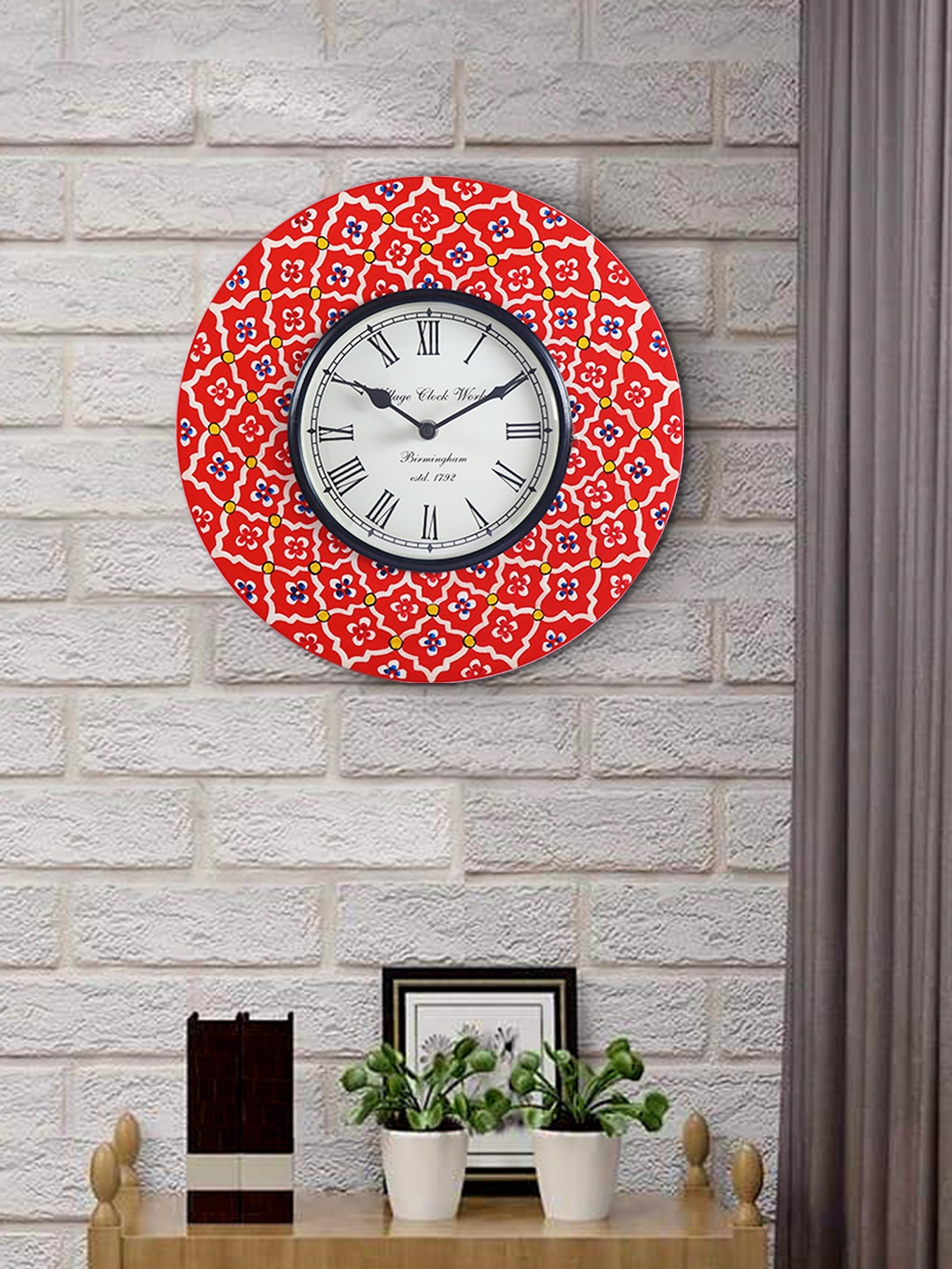 

Aapno Rajasthan Red & Blue Printed Round Traditional Wall Clock