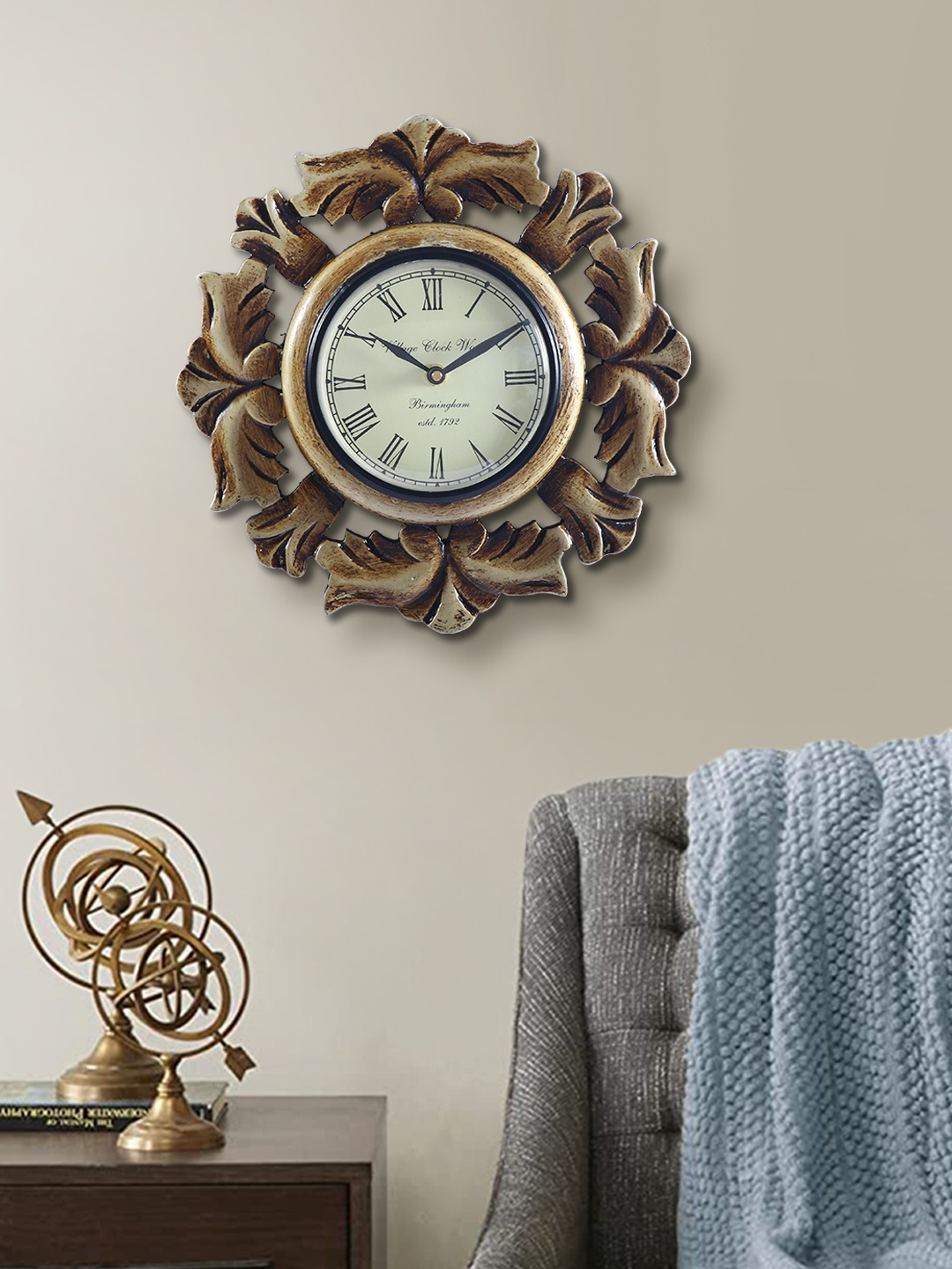 

Aapno Rajasthan Copper-Toned & White Embellished Contemporary Wall Clock