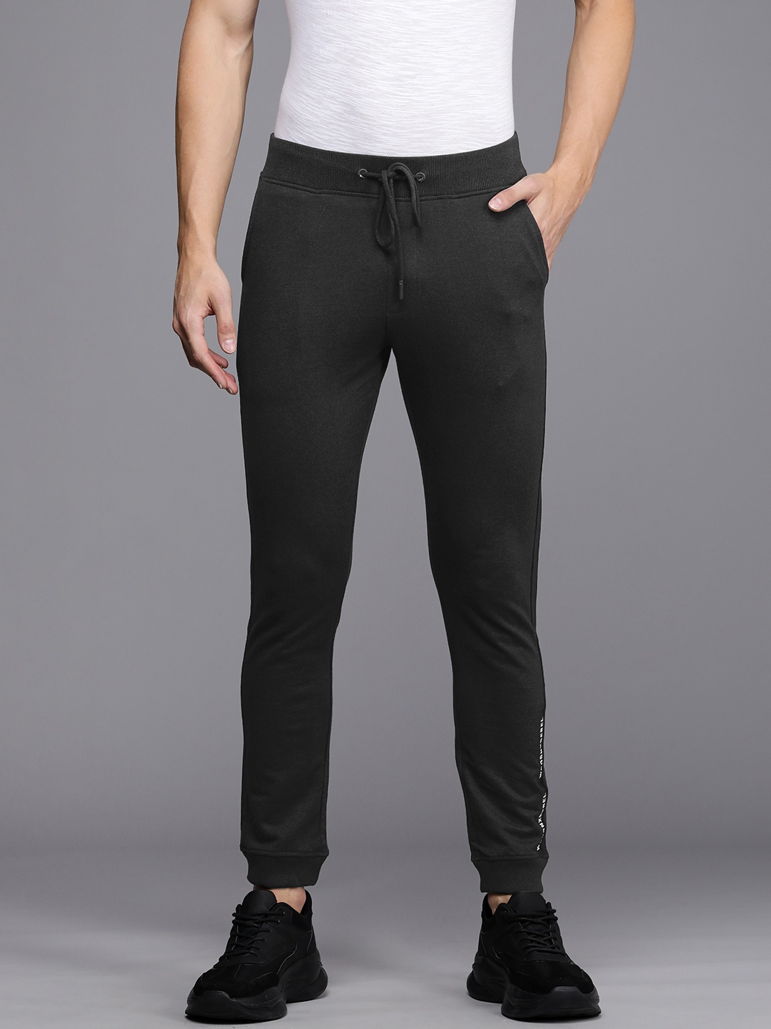 

WROGN Men Charcoal Grey Solid Slim Fit Mid-Rise Knitted Joggers with Typography Print