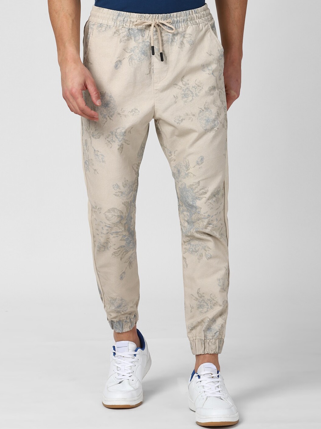 

Peter England Casuals Men Beige Floral Printed Casual Trousers