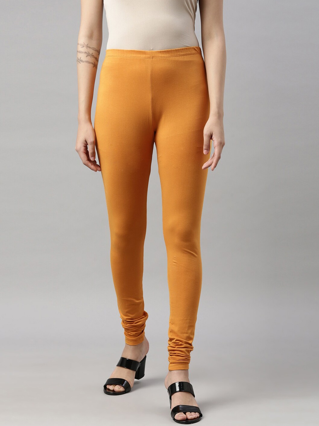 

GOLDSTROMS Women Mustard Solid Churidar-Length Leggings