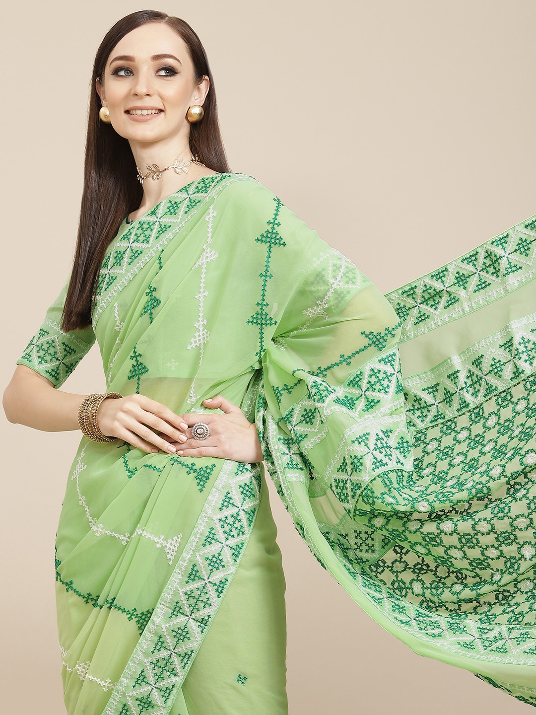 

Mitera Green & White Embroidered Pure Georgette Saree