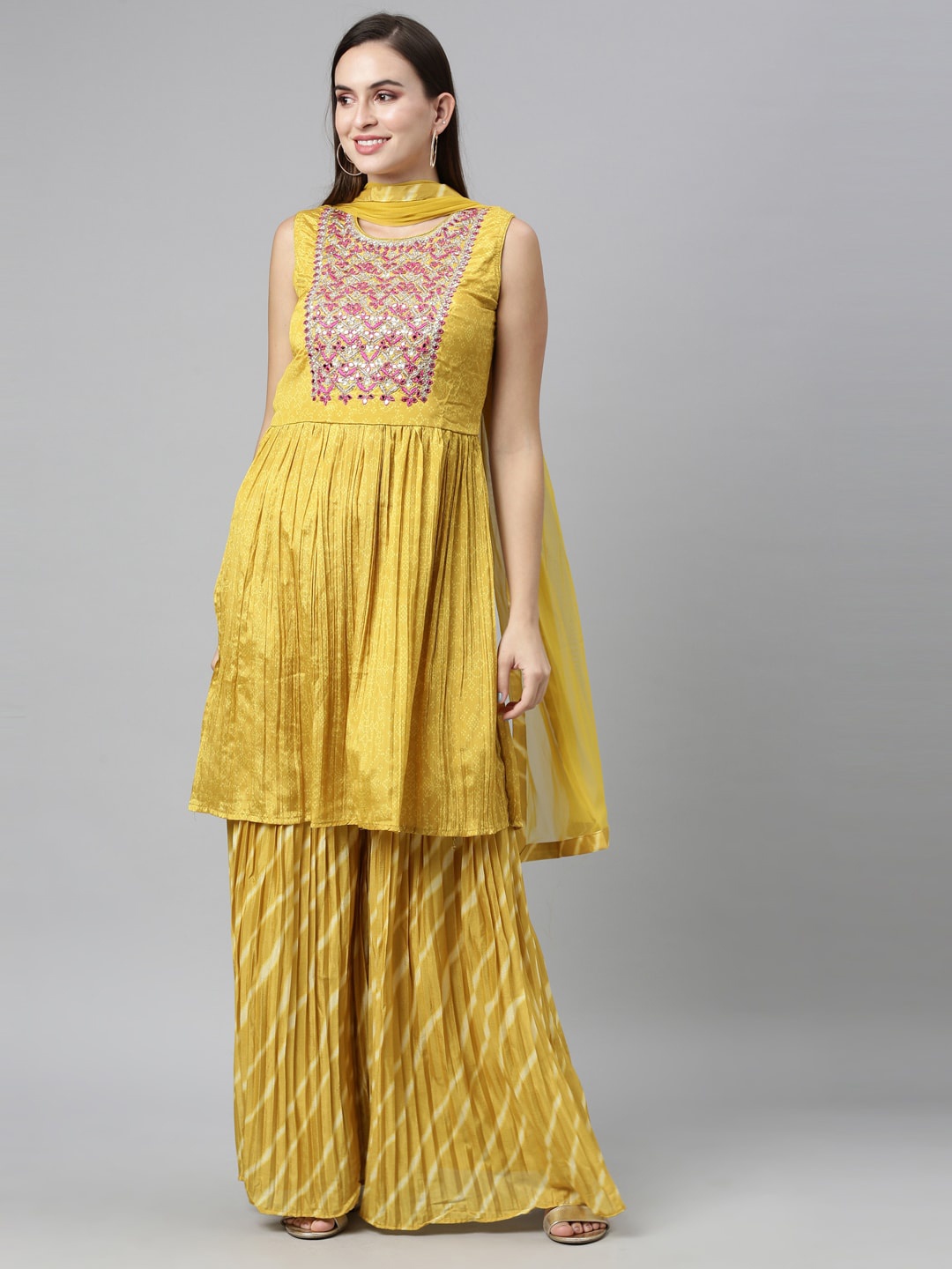 

Neerus Women Mustard Yellow Yoke Design Panelled Kurti with Sharara & With Dupatta