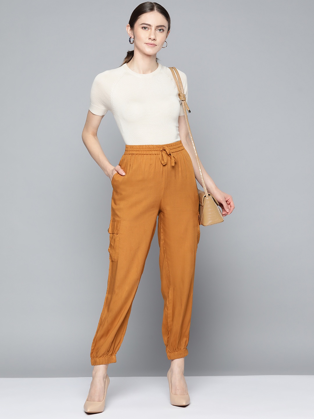 

Chemistry Women Mustard Yellow Solid Cargos Trousers