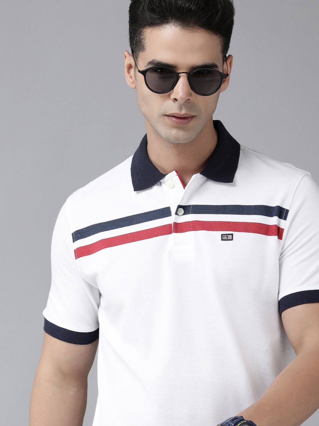 

Arrow Sport Men White & Red Solid Polo Collar T-shirt