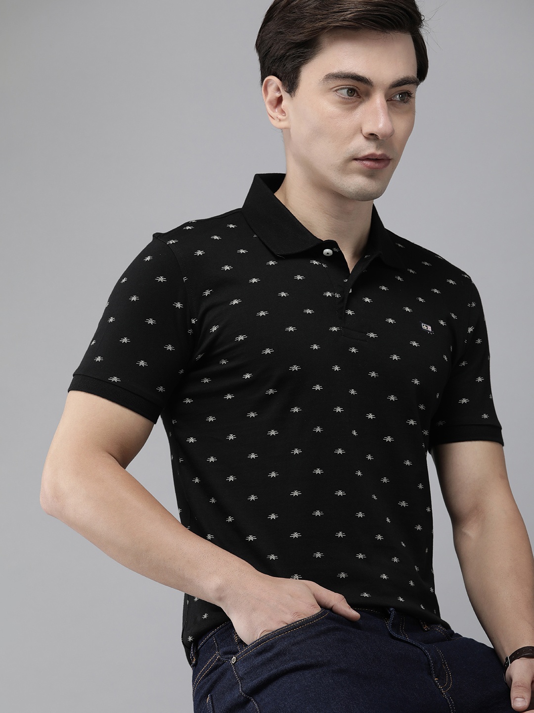 

Arrow Sport Men Black & White Printed Polo Collar Pure Cotton T-shirt