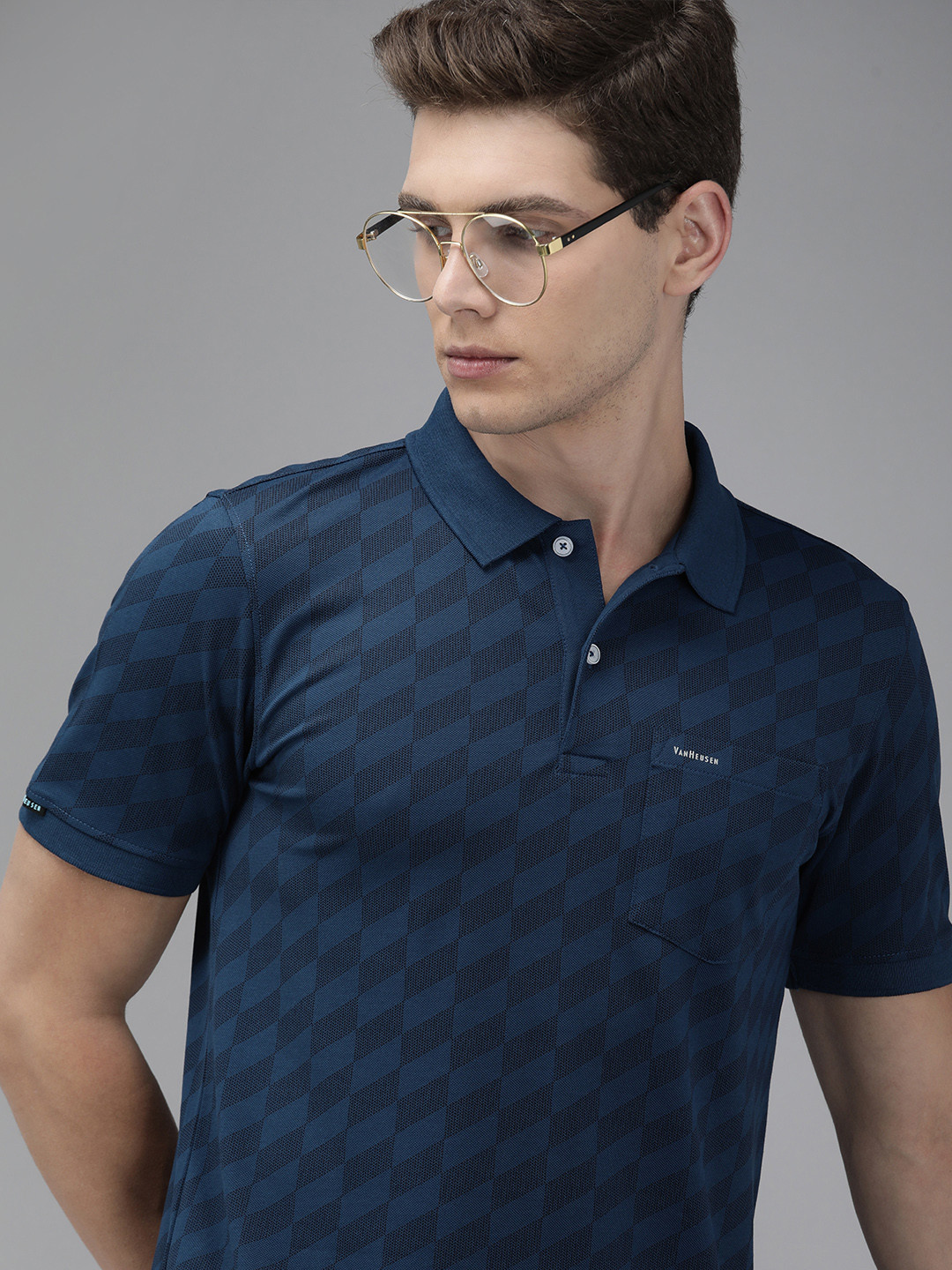 

Van Heusen Men Blue & Black Self Designed Polo Collar T-shirt