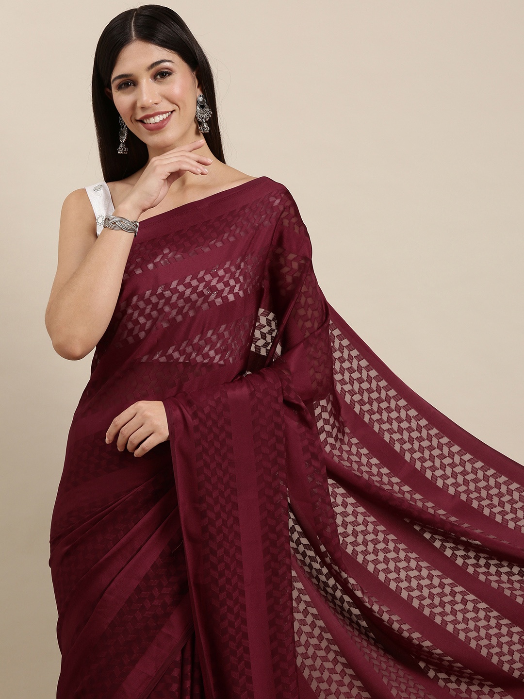 

Saree mall Maroon Self Design Satin Sarees with Tassel Border