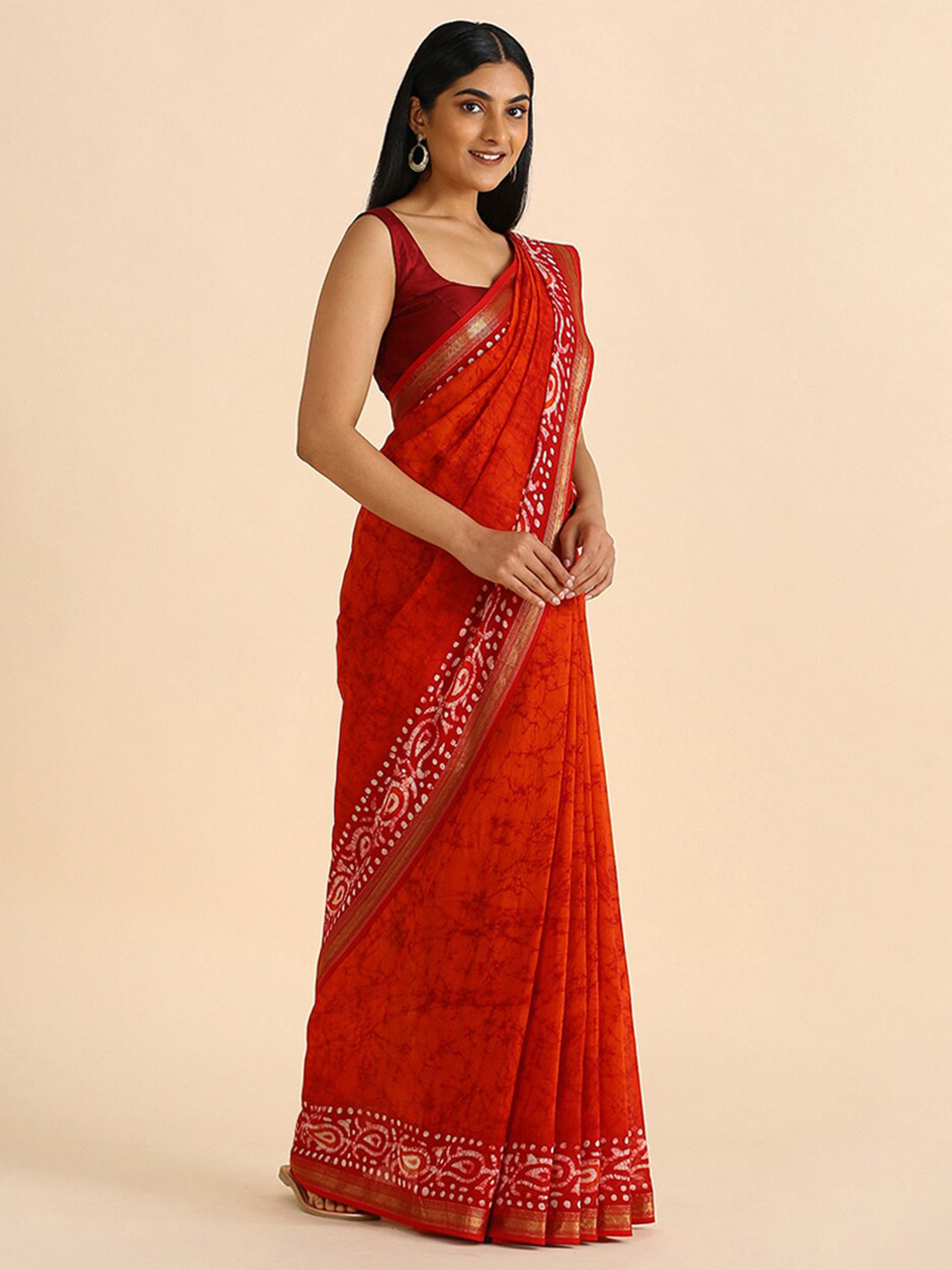 

Taneira Orange & Gold-Toned Ethnic Motifs Zari Silk Cotton Saree