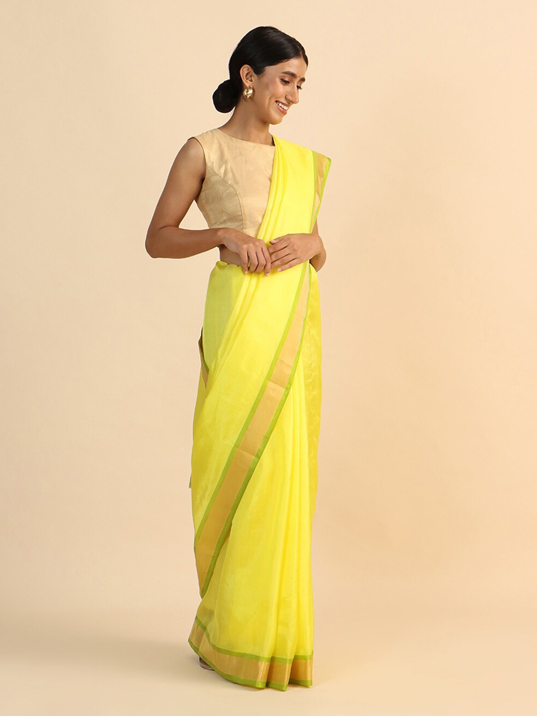 

Taneira Yellow & Gold-Toned Zari Pure Silk Saree