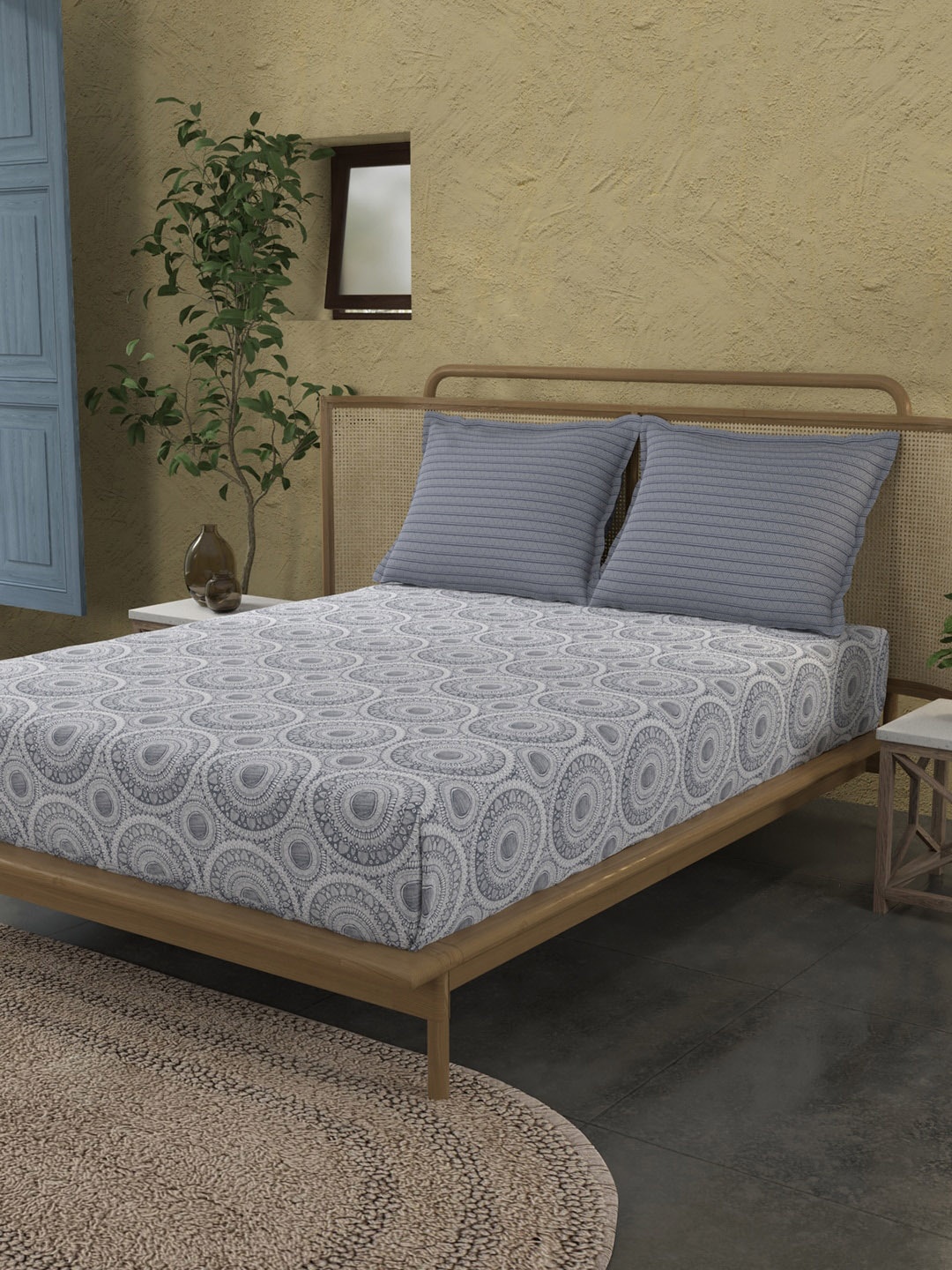 

Trident Stone Blue Printed Bedsheet With 2 Pillow Covers