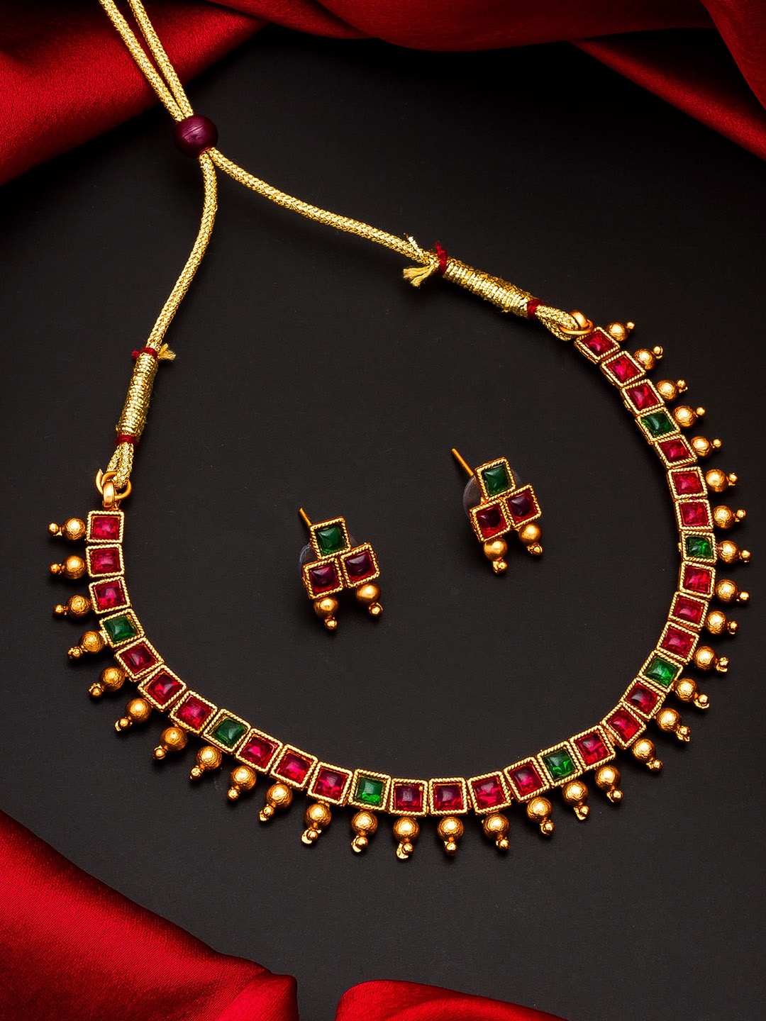 

aadita Gold-Plated Red Stone-Studded Meenakari Jewellery Set