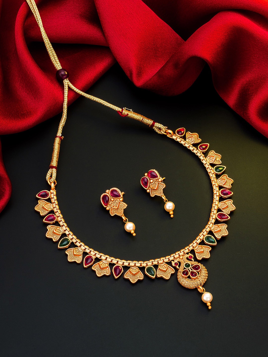 

aadita Gold-Toned & Pink Stones & Beads Studded Meenakari Jewellery Set