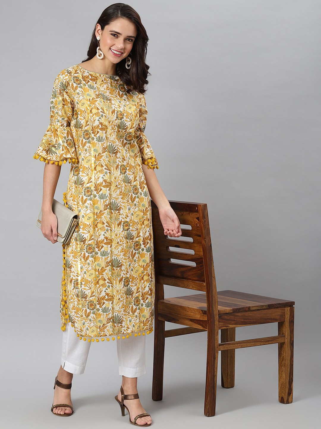 

Khushal K Women Yellow Floral Printed Flared Sleeves Kurta