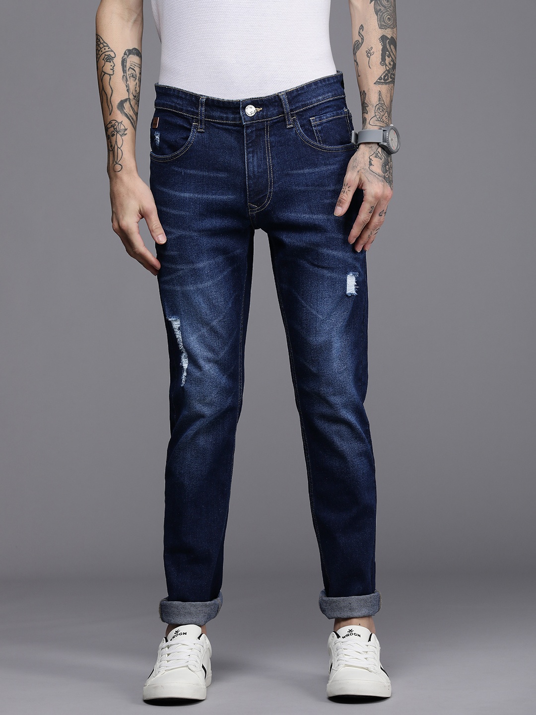 

WROGN Men Blue Slim Fit Mildly Distressed Light Fade Mid Rise Stretchable Jeans