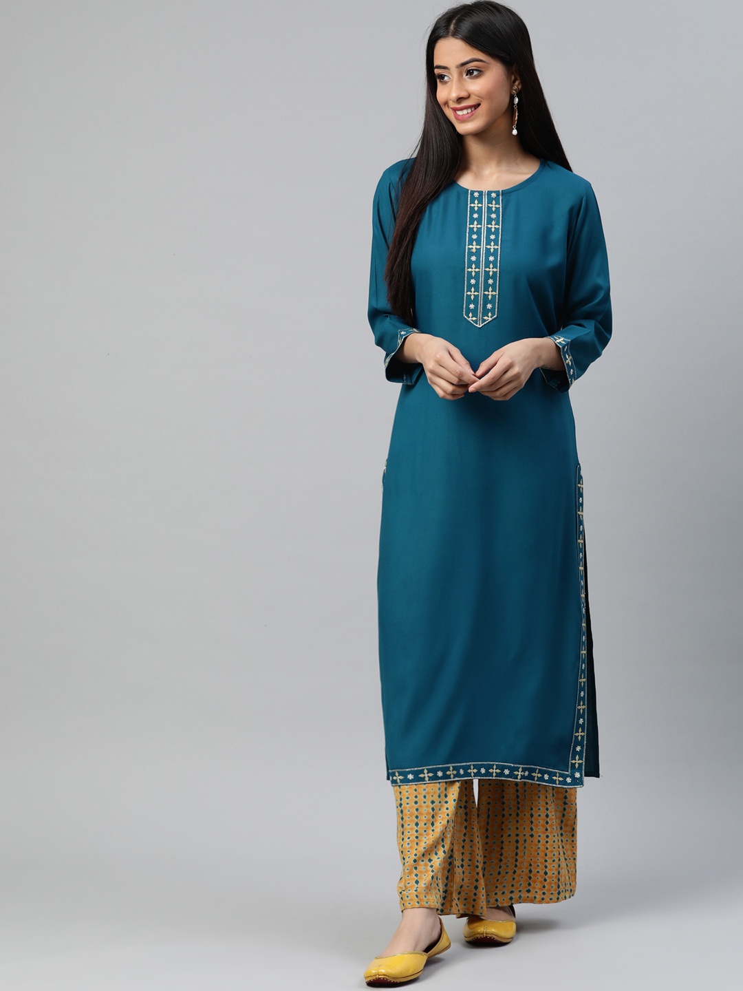 

aayusika Women Teal Blue & Orange Floral Embroidered Kurta with Palazzos