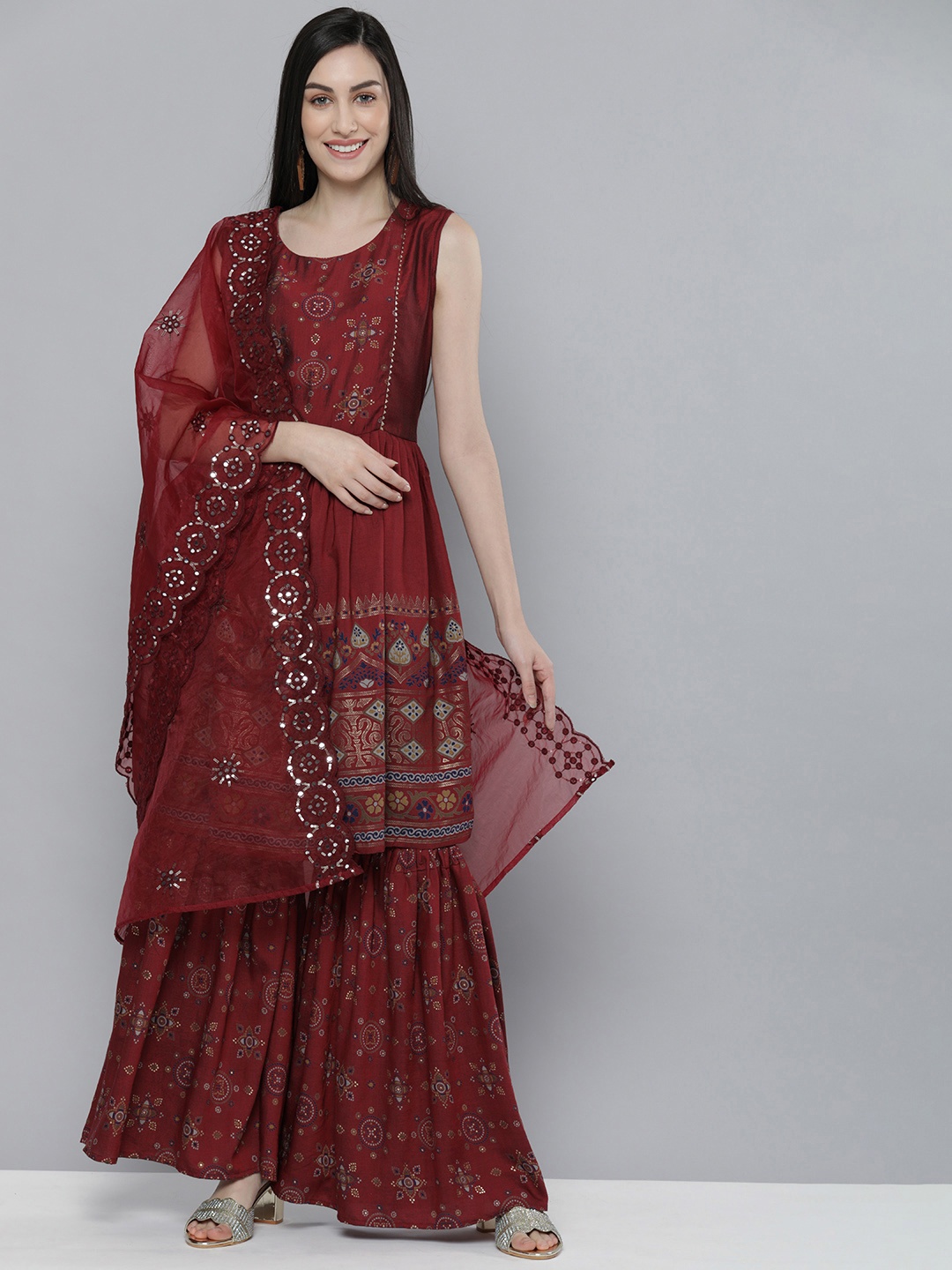 

Kvsfab Women Maroon Floral Printed Pleated Mirror Work Kurti with Sharara & With Dupatta