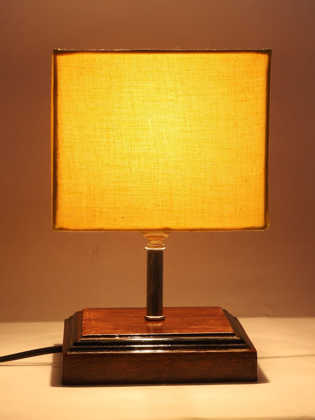 

Devansh Yellow & Brown Wooden Table Lamp with Cotton Square Shade