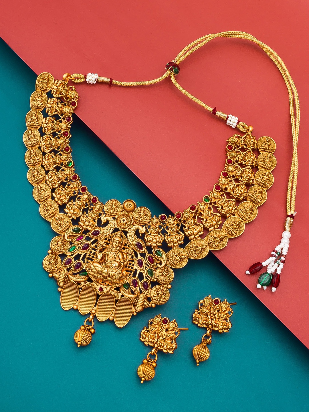 

aadita Gold-Plated Red & Green Stone-Studded & Beaded Temple Jewellery Set