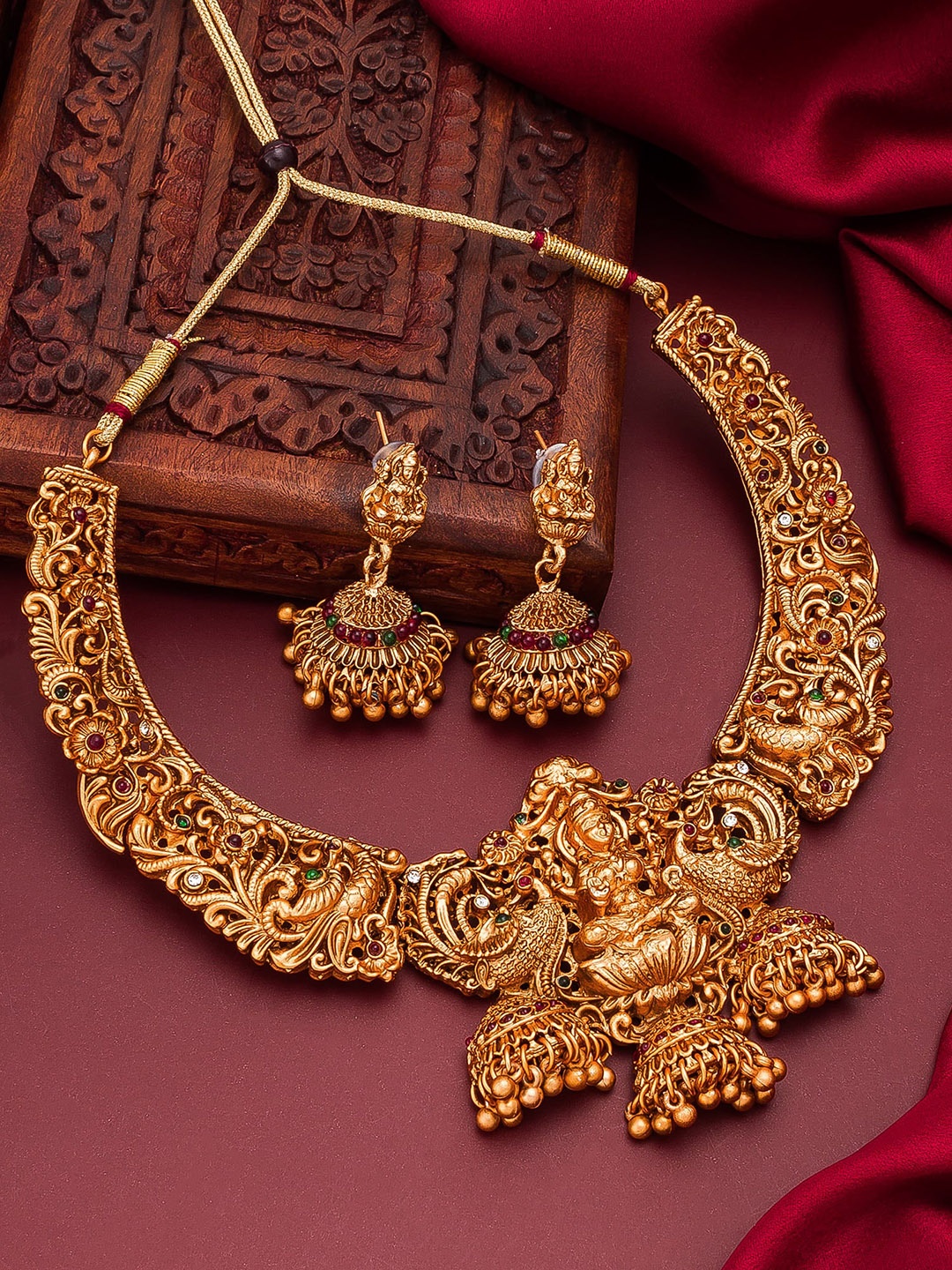 

aadita Gold-Plated Green & Red Stone-Studded Ghungroo Temple Jewellery Set