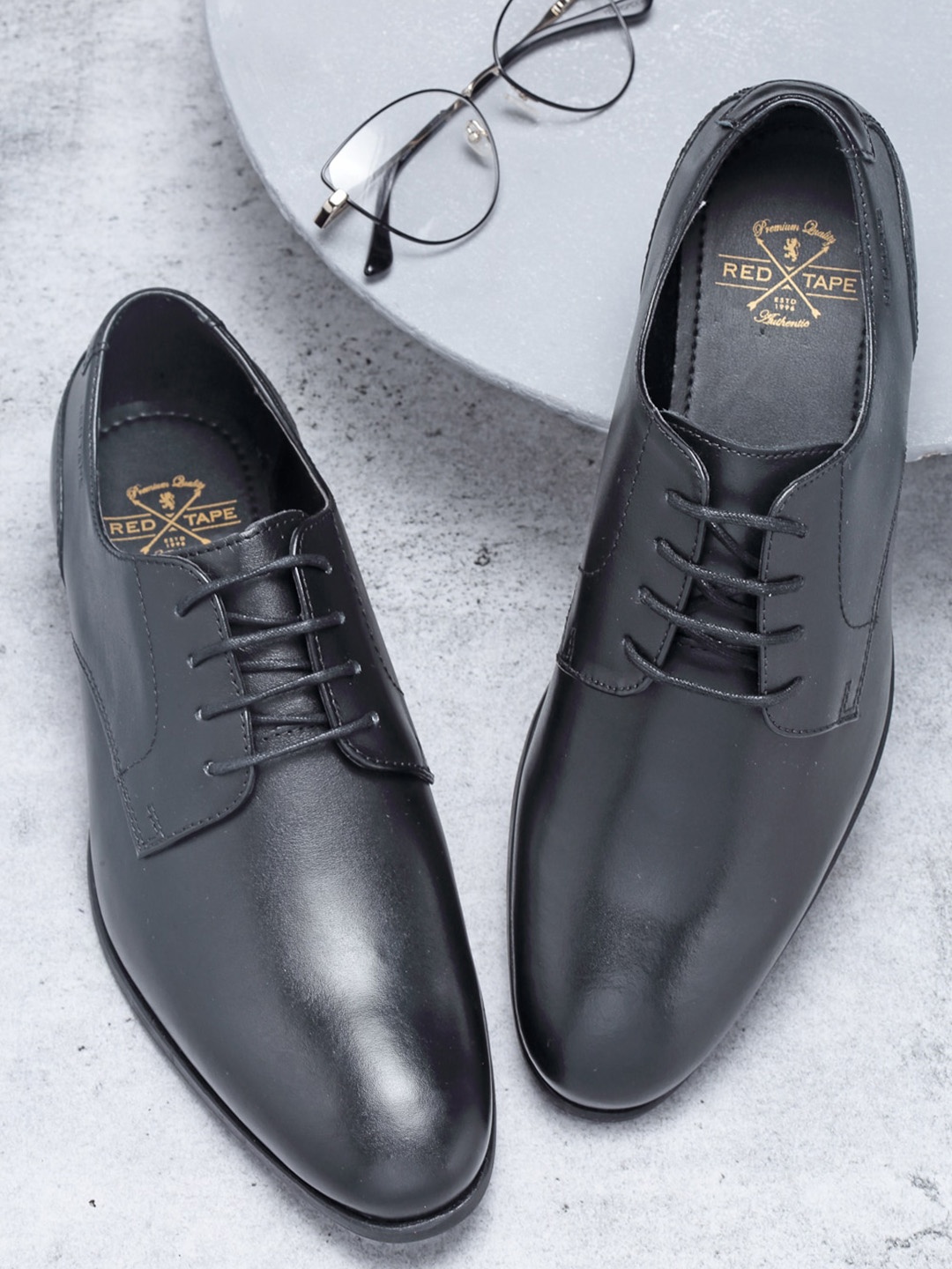 

Red Tape Men Black Solid Leather Formal Derbys