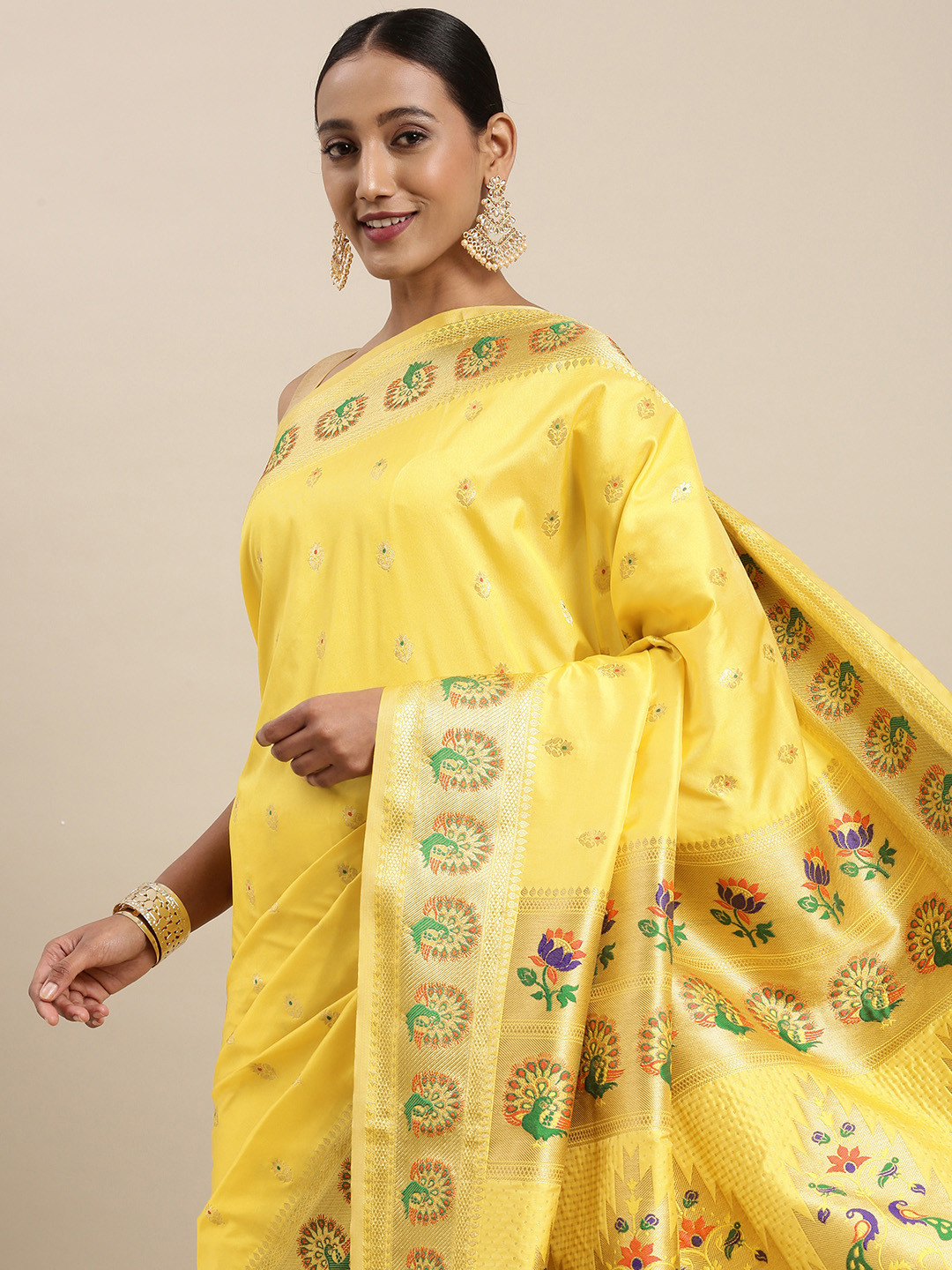 

Mitera Yellow & Golden Ethnic Motifs Woven Design Silk Blend Saree